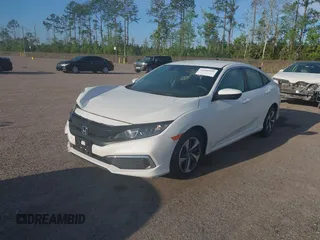 2020 Honda Civic LX with VIN 19XFC2F62LE212421, listed as a IAAI auction lot 41909995 with 46,312 mi miles and . Bid and sale history available at DreamBid. Image 18.