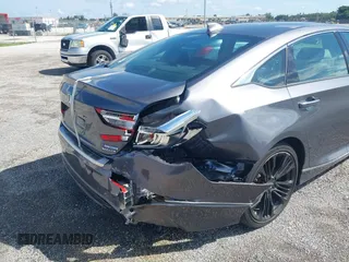 2022 Honda Accord Touring with VIN 1HGCV3F91NA031010, listed as a IAAI auction lot 40302407 with 18,820 mi miles and . Bid and sale history available at DreamBid. Image 6.