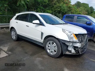 2013 Cadillac SRX Luxury Collection z VIN 3GYFNCE34DS653908, wystawiony jako IAAI lot #42240258 z przebiegiem 149 297 mil mil oraz . Historia ofert i sprzedaży dostępna na DreamBid. Obrazek 1.