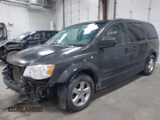 2012 Dodge Grand Caravan SXT with VIN 2C4RDGCG7CR358266, listed as a IAAI auction lot 41582428 with 169,137 mi miles and . Bid and sale history available at DreamBid. Image 2.