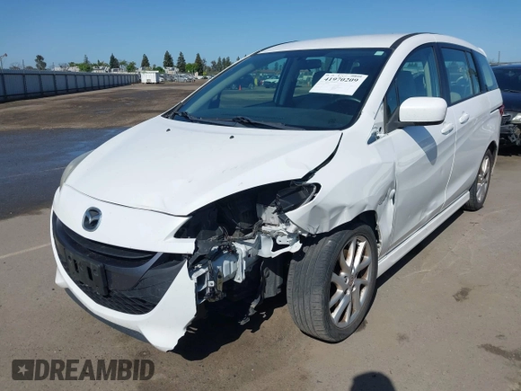 2012 Mazda 5 Touring with VIN JM1CW2CL7C0140452, listed as a IAAI auction lot 41970209 with 92,069 mi miles and . Bid and sale history available at DreamBid. Image 2.