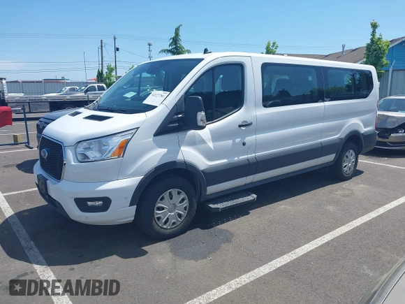 2021 Ford Transit Passenger XL with VIN 1FBAX2Y81MKA64794, listed as a IAAI auction lot 42227781 with 133,000 mi miles and . Bid and sale history available at DreamBid. Image 2.