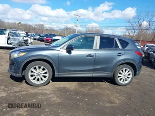 2013 Mazda CX-5 Grand Touring with VIN JM3KE4DE1D0164488, listed as a IAAI auction lot 41683326 with 129,989 mi miles. Bid and sale history available at carsss.com. Image 14.
