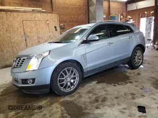 2014 Cadillac SRX Premium Collection z VIN 3GYFNGE33ES550200, wystawiony jako Copart lot #53638905 z przebiegiem 65 247 mil mil oraz Szkody całkowita. Historia ofert i sprzedaży dostępna na DreamBid. Obrazek 1.