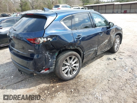 2021 Mazda CX-5 Grand Touring with VIN JM3KFBDM8M0484383, listed as a IAAI auction lot 41800786 with 58,617 mi miles. Bid and sale history available at carsss.com. Image 4.