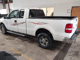 2005 Ford F-150 XLT with VIN 1FTPX14565FB60720, listed as a IAAI auction lot 41728673 with 148,187 mi miles. Bid and sale history available at carsss.com. Image 3.