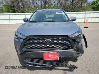 2023 Toyota Corolla Cross LE with VIN 7MUCAABG4PV054828, listed as a Copart auction lot 59466855 with 23,884 mi miles and Salvage title. Bid and sale history available at DreamBid. Image 5.
