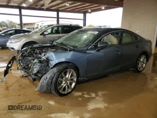 2014 Mazda 6 i Grand Touring с VIN JM1GJ1W53E1104181, выставлен на аукционе Copart как лот 51261045 с пробегом 289 302 миль миль и Списание • Salvage title. История ставок и продаж доступна на DreamBid. Изображение 1.