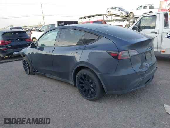 2023 Tesla Model Y Long Range with VIN 7SAYGDEE1PA053683, listed as a IAAI auction lot 42124517 with 32,295 mi miles. Bid and sale history available at carsss.com. Image 3.
