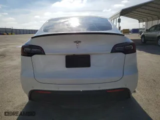 2022 Tesla Model Y Long Range with VIN 7SAYGDEE1NF559238, listed as a Copart auction lot 86744664 with 59,074 mi miles and Salvage Title. Bid and sale history available at carsss.com. Image 6.