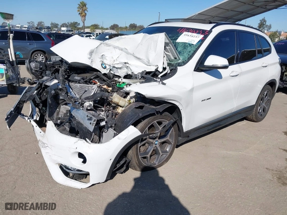 2016 BMW X1 xDrive28i with VIN WBXHT3C32G5E51855, listed as a IAAI auction lot 41634237 with 69,101 mi miles. Bid and sale history available at carsss.com. Image 16.