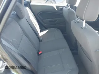 2019 Ford Fiesta SE z VIN 3FADP4BJ2KM131012, wystawiony jako IAAI lot #42228822 z przebiegiem 100 460 mil mil oraz . Historia ofert i sprzedaży dostępna na DreamBid. Obrazek 8.