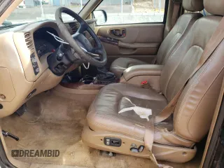 2000 Oldsmobile Bravada z VIN 1GHDT13W3Y2178106, wystawiony jako Copart lot #85069954 z przebiegiem 211 164 mil mil oraz Szkody całkowita. Historia ofert i sprzedaży dostępna na DreamBid. Obrazek 7.