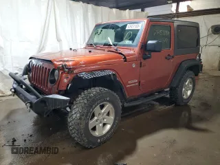 2014 Jeep Wrangler Sport with VIN 1C4AJWAG7EL197285, listed as a Copart auction lot 63451105 with 141,547 mi miles and Salvage title. Bid and sale history available at DreamBid. Image 1.