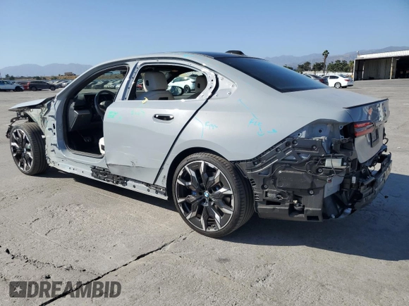 2024 BMW 5 Series 530i with VIN WBA43FJ06RCP67824, listed as a Copart auction lot 61351965 with 12,990 mi miles and Salvage title. Bid and sale history available at DreamBid. Image 2.
