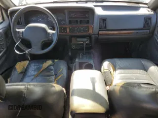 1996 Jeep Grand Cherokee Laredo with VIN 1J4GZ58S1TC340018, listed as a Copart auction lot 86571454 with 0 mi miles and Salvage Title. Bid and sale history available at carsss.com. Image 8.