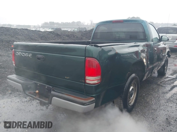 1999 Dodge Dakota SLT with VIN 1B7FL26XXXS209424, listed as a IAAI auction lot 41264544 with 70,523 mi miles. Bid and sale history available at carsss.com. Image 4.