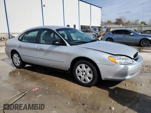 2003 Ford Taurus LX Standard z VIN 1FAFP52U93A159333, wystawiony jako Copart lot #78080944 z przebiegiem 54 652 mil mil oraz Szkoda całkowita • Salvage title. Historia ofert i sprzedaży dostępna na DreamBid. Obrazek 4.