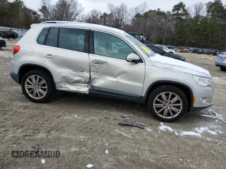 2010 Volkswagen Tiguan with VIN WVGAV9AX7AW514556, listed as a Copart auction lot 45373655 with 94,751 mi miles and Salvage Title. Bid and sale history available at DreamBid. Image 4.