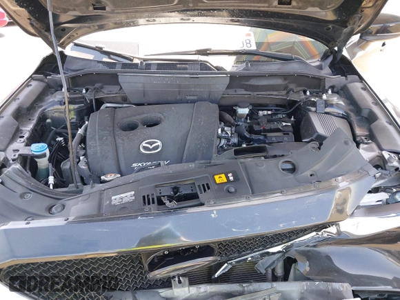 2018 Mazda CX-5 Grand Touring z VIN JM3KFADM7J0327272, wystawiony jako IAAI lot #42279536 z przebiegiem 97 478 mil mil oraz . Historia ofert i sprzedaży dostępna na DreamBid. Obrazek 10.