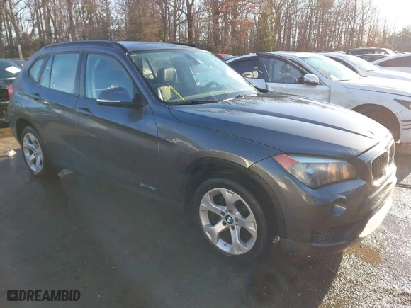 2014 BMW X1 sDrive28i with VIN WBAVM1C52EVW55890, listed as a IAAI auction lot 41512784 with 97,718 mi miles. Bid and sale history available at carsss.com. Image 1.