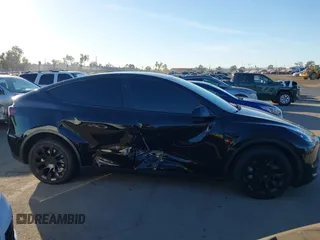 2024 Tesla Model Y Long Range with VIN 7SAYGDEEXRA216186, listed as a IAAI auction lot 41106653 with 25,331 mi miles and . Bid and sale history available at DreamBid. Image 13.