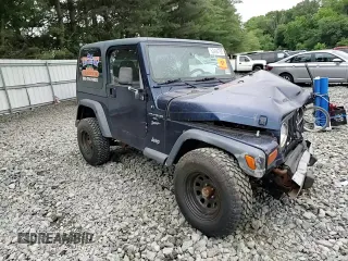 2001 Jeep Wrangler Sport with VIN 1J4FA49S01P363856, listed as a Copart auction lot 62494785 with 154,782 mi miles and Salvage title. Bid and sale history available at DreamBid. Image 12.