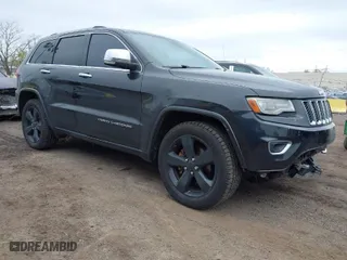 2014 Jeep Grand Cherokee Overland with VIN 1C4RJFCG6EC121654, listed as a IAAI auction lot 42051730 with 163,853 mi miles. Bid and sale history available at carsss.com. Image 1.