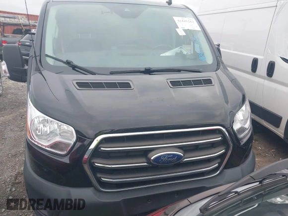 2020 Ford Transit Cargo with VIN 1FTYE1Y80LKB76611, listed as a IAAI auction lot 42445263 with 104,540 mi miles and . Bid and sale history available at DreamBid. Image 12.