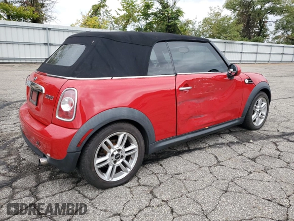 2011 MINI Convertible with VIN WMWZN3C51BTZ78331, listed as a Copart auction lot 73348304 with 94,219 mi miles and Salvage title. Bid and sale history available at DreamBid. Image 3.
