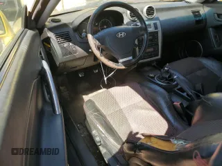 2006 Hyundai Tiburon GT z VIN KMHHN65F96U203308, wystawiony jako Copart lot #47278684 z przebiegiem 186 123 mil mil oraz Szkoda całkowita • Salvage title. Historia ofert i sprzedaży dostępna na DreamBid. Obrazek 8.