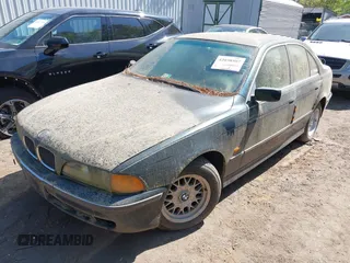 1997 BMW 5 Series 528iA with VIN WBADD6329VBW04841, listed as a IAAI auction lot 42038507 with 147,762 mi miles. Bid and sale history available at carsss.com. Image 2.