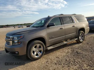 2018 Chevrolet Suburban LT z VIN 1GNSCHKC6JR385719, wystawiony jako Copart lot #51190395 z przebiegiem 98 658 mil mil oraz Czysty tytuł • Clean title. Historia ofert i sprzedaży dostępna na DreamBid. Obrazek 1.