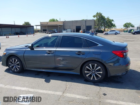 2023 Honda Civic EX with VIN 2HGFE1F74PH323979, listed as a IAAI auction lot 42499373 with 70,326 mi miles and . Bid and sale history available at DreamBid. Image 14.