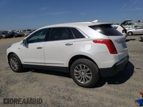 2017 Cadillac XT5 Luxury AWD with VIN 1GYKNDRS0HZ180703, listed as a Copart auction lot 58793895 with 30,339 mi miles and Salvage title. Bid and sale history available at DreamBid. Image 2.