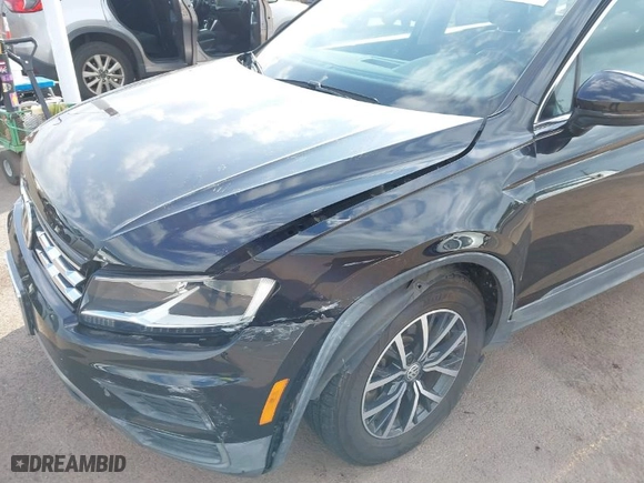 2019 Volkswagen Tiguan SE with VIN 3VV3B7AXXKM012766, listed as a IAAI auction lot 41571347 with 56,594 mi miles. Bid and sale history available at carsss.com. Image 6.