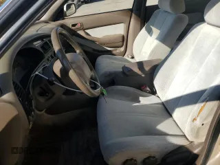 1994 Toyota Camry LE z VIN JT2GK12EXR0070117, wystawiony jako Copart lot #75997244 z przebiegiem 185 759 mil mil oraz Czysty tytuł • Clean title. Historia ofert i sprzedaży dostępna na DreamBid. Obrazek 7.