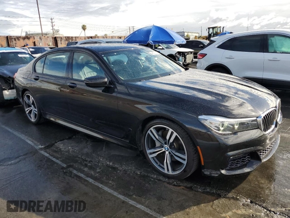 2017 BMW 7 Series 740i with VIN WBA7E2C59HG739788, listed as a Copart auction lot 48073105 with 36,274 mi miles and Salvage Title. Bid and sale history available at carsss.com. Image 4.