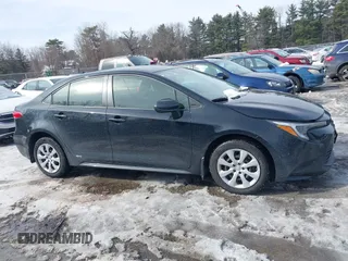2023 Toyota Corolla Hybrid LE with VIN JTDBDMHE7P3004396, listed as a IAAI auction lot 41606222 with 15,037 mi miles. Bid and sale history available at carsss.com. Image 13.