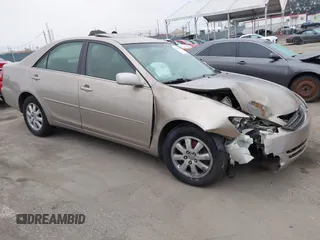 2003 Toyota Camry LE z VIN 4T1BF32K33U053534, wystawiony jako IAAI lot #42429210 z przebiegiem 209 005 mil mil oraz . Historia ofert i sprzedaży dostępna na DreamBid. Obrazek 1.