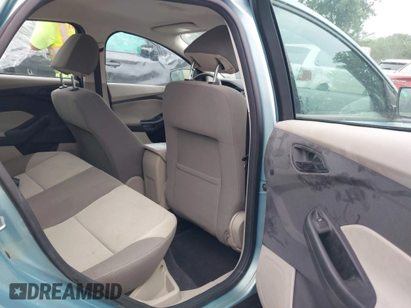 2012 Ford Focus SE with VIN 1FAHP3F29CL464650, listed as a IAAI auction lot 42495994 with 142,336 mi miles and . Bid and sale history available at DreamBid. Image 8.