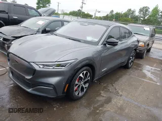 2021 Ford Mustang Mach-E Premium z VIN 3FMTK3R74MMA27709, wystawiony jako IAAI lot #42102335 z przebiegiem 54 988 mil mil oraz . Historia ofert i sprzedaży dostępna na DreamBid. Obrazek 21.