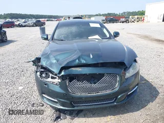2014 Jaguar XJ Portfolio z VIN SAJWA2GZ4E8V60315, wystawiony jako IAAI lot #42293880 z przebiegiem 97 712 mil mil oraz . Historia ofert i sprzedaży dostępna na DreamBid. Obrazek 6.