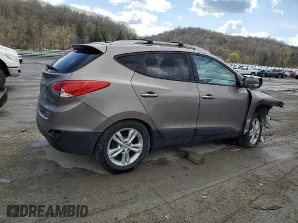 2011 Hyundai Tucson Limited with VIN KM8JUCAC2BU200517, listed as a Copart auction lot 53252005 with 158,502 mi miles and Salvage Title. Bid and sale history available at DreamBid. Image 3.