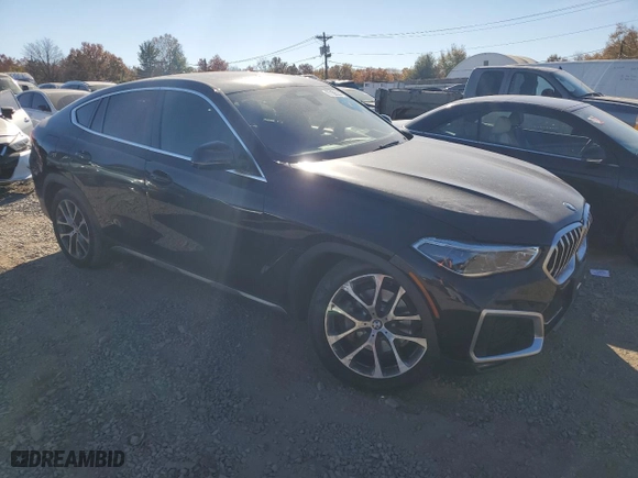 2021 BMW X6 xDrive40i with VIN 5UXCY6C07M9D94944, listed as a Copart auction lot 77106334 with 52,106 mi miles and Salvage Title. Bid and sale history available at carsss.com. Image 4.
