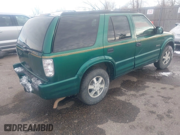 1999 Oldsmobile Bravada z VIN 1GHDT13W7X2711363, wystawiony jako IAAI lot #41294782 z przebiegiem 198 508 mil mil oraz . Historia ofert i sprzedaży dostępna na DreamBid. Obrazek 4.