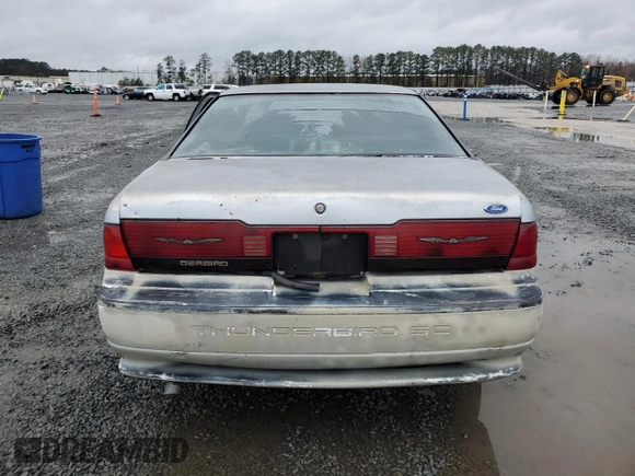 1990 Ford Thunderbird with VIN 1FAPP6046LH182637, listed as a Copart auction lot 82300484 with 149,365 mi miles and Salvage Title. Bid and sale history available at DreamBid. Image 6.