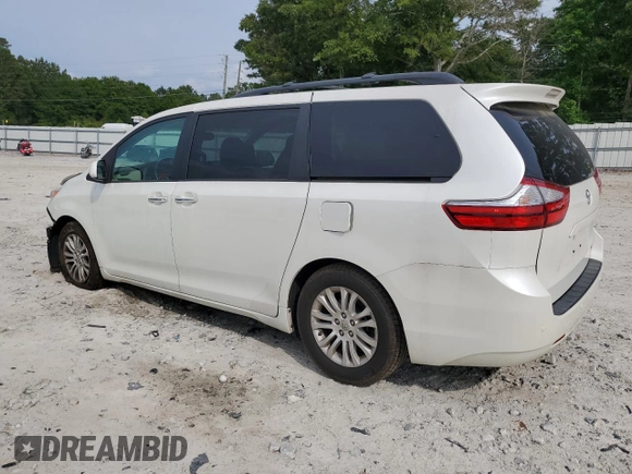 2016 Toyota Sienna XLE with VIN 5TDYK3DC3GS730639, listed as a Copart auction lot 57379935 with 105,323 mi miles and Salvage title. Bid and sale history available at DreamBid. Image 2.