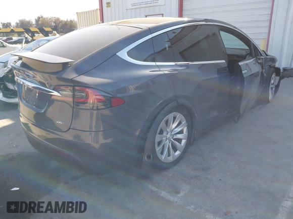 2018 Tesla Model X 75D with VIN 5YJXCDE28JF142509, listed as a IAAI auction lot 41993444 with 100,244 mi miles and . Bid and sale history available at carsss.com. Image 4.