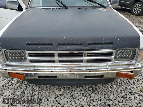 1990 Nissan Frontier with VIN 1N6SD16S9LC404281, listed as a Copart auction lot 84214904 with 279,270 mi miles and Salvage title. Bid and sale history available at DreamBid. Image 12.